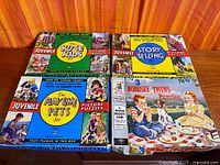 Overview of four boxed puzzle sets on table