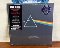 Front of sealed LP showing prism artwork, hype and title stickers