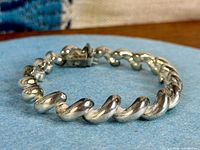 Bracelet angled to show chunky twisted curb links and box clasp
