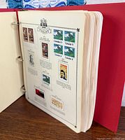 Album page showing mounted Canadian stamps and page header