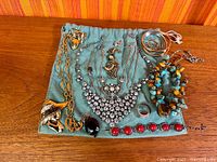 Full overview of all jewelry pieces on fabric pouch
