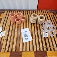 Overview of two bamboo placemats and three styles of napkin rings