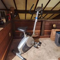 Full view of Body Fit stationary bike showing frame, seat, pedals and size