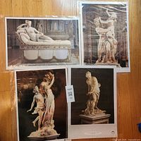 All four posters laid out on floor