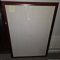 Full view of brown wooden frame standing upright