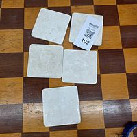 Five square ceramic coasters front view