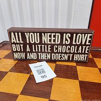 Front view of wooden quote sign