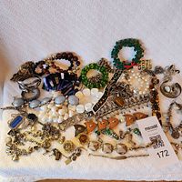 Overall view of assorted costume jewelry laid out