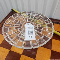 Top view of pressed glass cake plate showing radial grid design