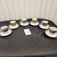 Full set of six cups and saucers on display