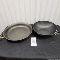 Both Calphalon pans side by side on table