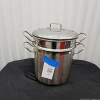 Full view of assembled stock pot with steamer insert and lid