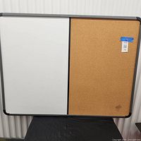 Full view of combination board showing white dry-erase half and cork half