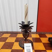 Full view of pineapple candle holder with candle