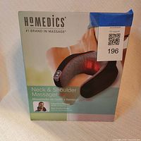 Front of retail box showing Homedics neck & shoulder massager image
