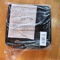 sealed package showing cooler/grill set with instruction sheet and lot label