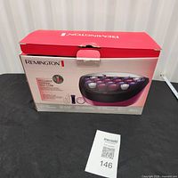 Retail box front showing Remington branding and image of roller unit