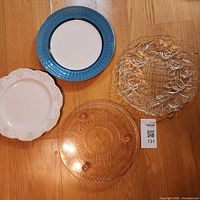 Group shot of all four platters on wood floor