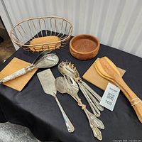 Full lot view with basket, bowl, utensils, boards