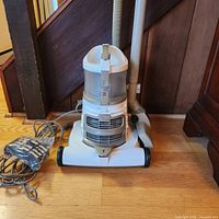 Full view of Shark Lift-Around vacuum showing body, hose, wand and wheels