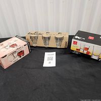 Three boxed sets of shot glasses