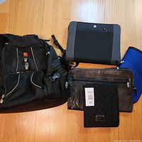 Group shot showing backpack and three organizers