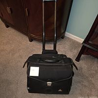 Full view of Supra rolling briefcase with handle extended
