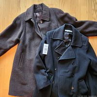 Both coats laid out showing overall style and colors
