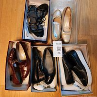 All five shoe pairs in boxes