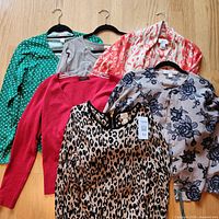 All six sweaters displayed on floor