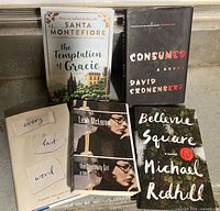 Front covers of the five hardcover novels