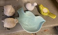 All five ceramic bird decor items grouped together