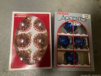 Front view of both ornament boxes showing colors and quantities