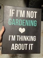 Front view of one gardening quote sign showing full text and color scheme