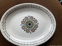 Top view of oval platter showing Renaissance pattern and border