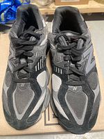 Top view of both New Balance 9060 sneakers showing color and condition