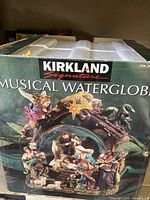 Box showing Kirkland Signature Musical Waterglobe with nativity scene
