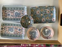 Overview of all five ceramic pieces showing patterns and shapes