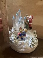 Full view showing castle, Santa, skaters, ruler indicating height