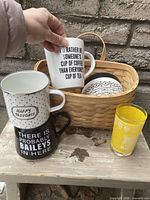 Group shot showing basket, nested mugs, planter and yellow tumbler