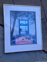 Front view of framed art print with gold frame and mat