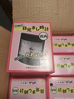 Front of individual alarm clock box showing product image and Japanese text