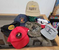 All seven Second Amendment and NRA themed baseball caps on display