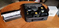AirGun inflator in case with two batteries, charger, tac pen box, spare battery box