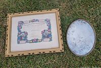 Rectangular gilt frame with baptism certificate and oval convex glass frame front