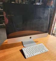 Front view of Apple iMac A1311 with wireless keyboard placed in front