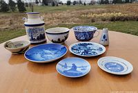 Group view of all nine blue and white ceramics on table