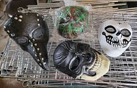 Group shot of four masks on rack