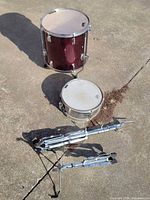 Overall view of floor tom, snare drum, two stands