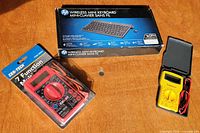 Boxed HP wireless mini keyboard, sealed Cen-Tech multimeter, open RadioShack multimeter
